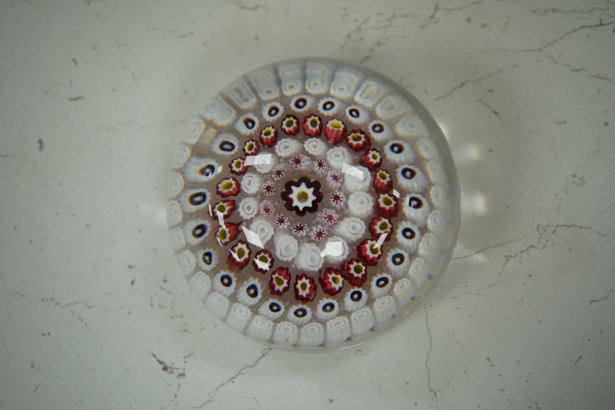 Two Victorian English millefiori glass paperweights, 7cm tall. Condition - fair to good